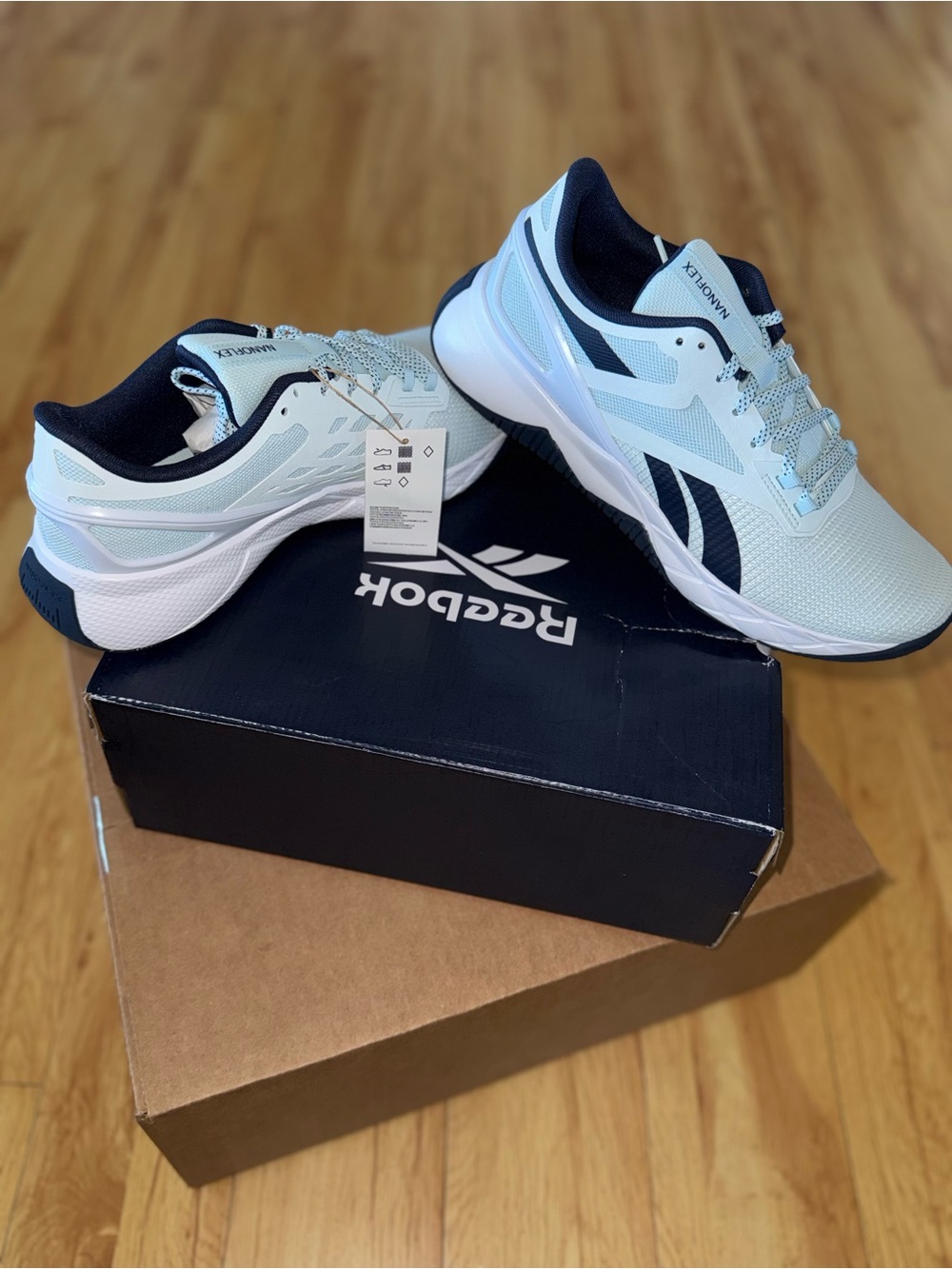 Reebok Women’s Nanoflex TR Sneakers in Light Blue and Navy Accent